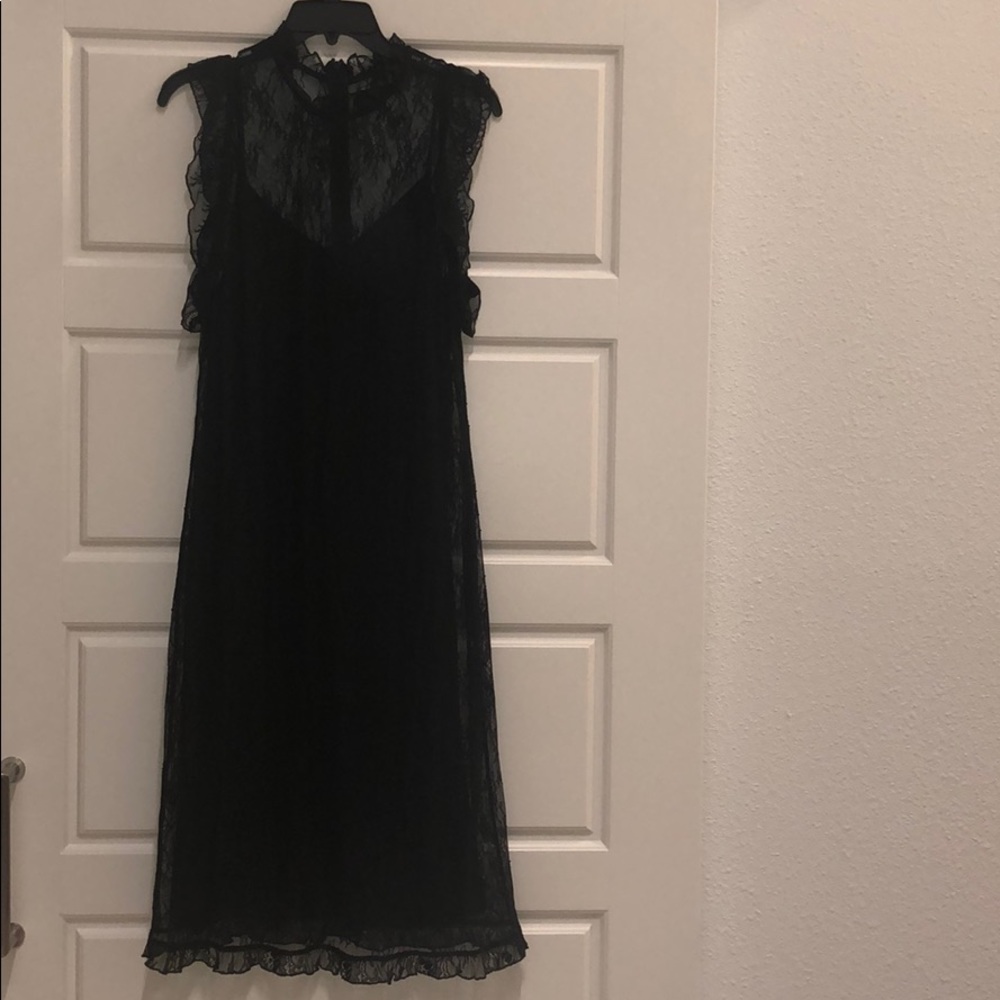 Sleeveless, black lace dress with slip